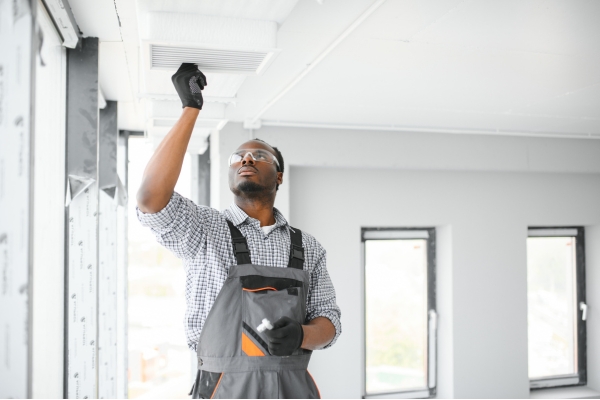 Certified HVAC technician performing system installation and maintenance